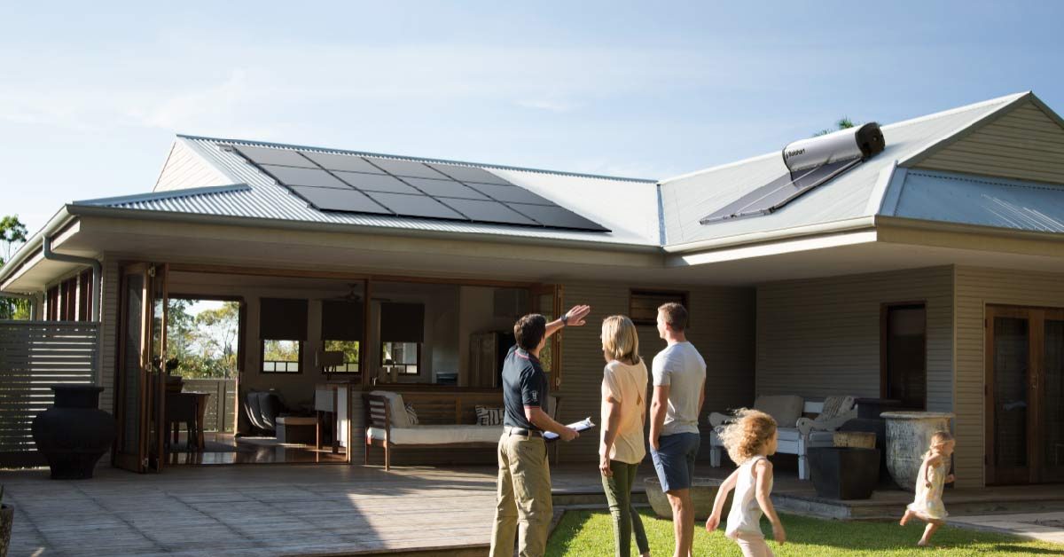 Solahart Installer and home owners discussing Solarpanels